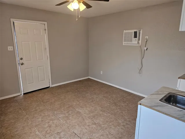 a view of a room with a fan