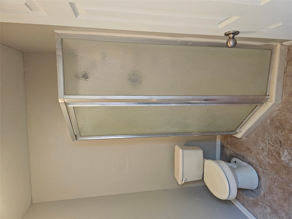 302 Burning Tree Drive Georgetown, TX 78628 - Photo 26 of 30 a white toilet sitting next to a shower