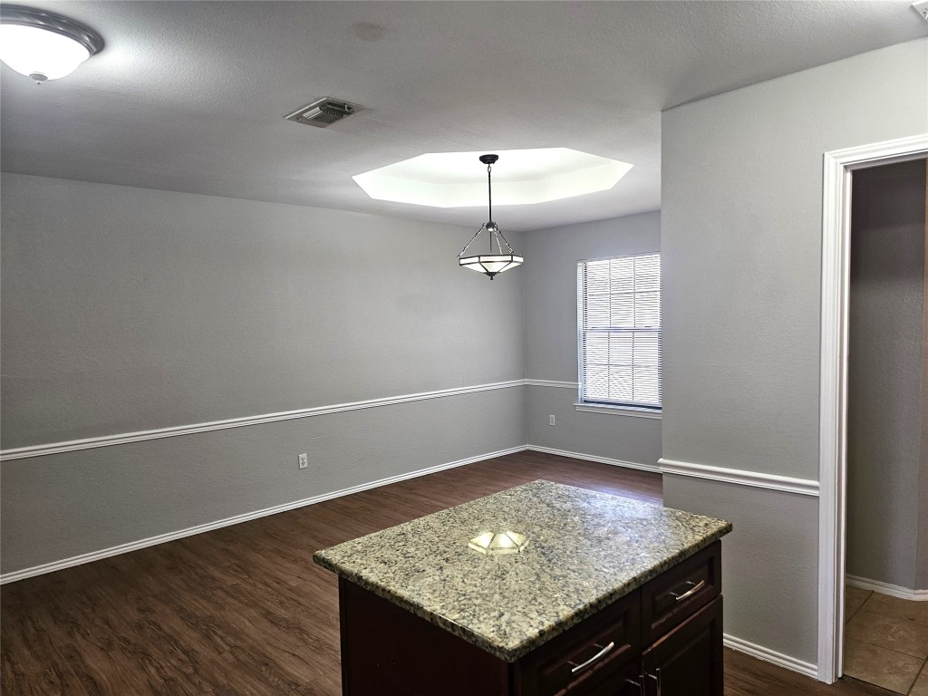 302 Burning Tree Drive Georgetown, TX 78628 - Photo 9 of 30 an empty room with wooden floor and window