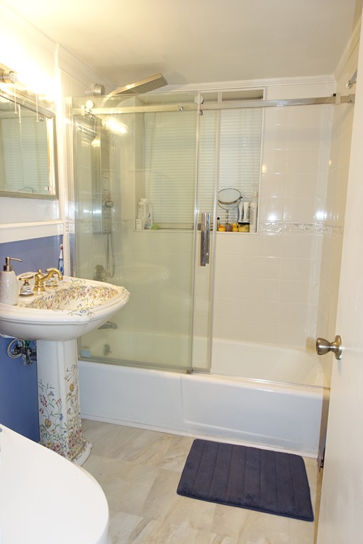 58 Bryon Road, Unit 2 Boston, MA 02467 - Photo 6 of 6 a bathroom with a sink a toilet and shower
