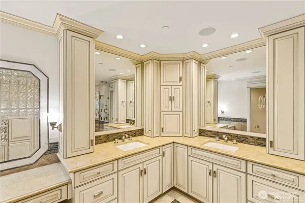 a bathroom with a double vanity sink mirror and