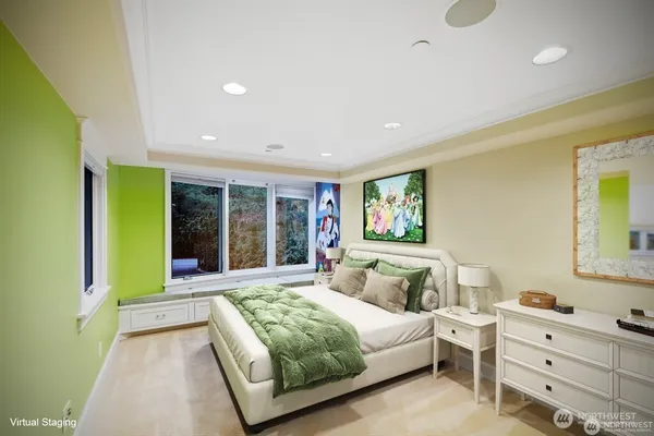 a bedroom with a bed and a large window