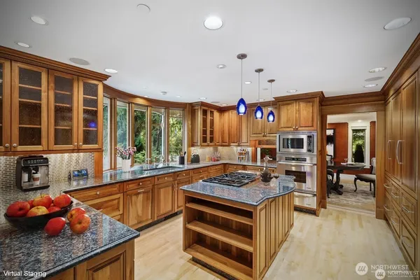 a kitchen with stainless steel appliances granite countertop a stove and a sink