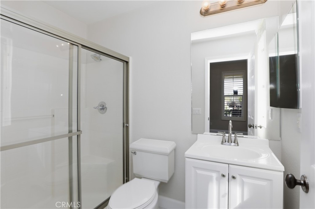 8075 Terraza Court Riverside, CA 92508 - Photo 16 of 75 a bathroom with a sink toilet and shower