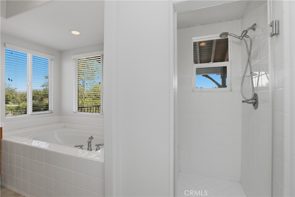 8075 Terraza Court Riverside, CA 92508 - Photo 23 of 75 a bathroom with a bathtub and a window