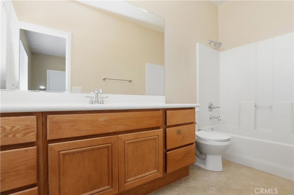 8075 Terraza Court Riverside, CA 92508 - Photo 28 of 75 a bathroom with a sink toilet and shower
