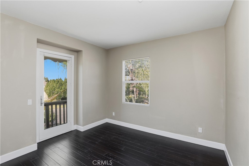8075 Terraza Court Riverside, CA 92508 - Photo 29 of 75 a view of an empty room with wooden floor and a window