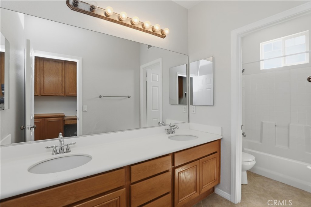 8075 Terraza Court Riverside, CA 92508 - Photo 32 of 75 a bathroom with a double vanity sink mirror and bathtub