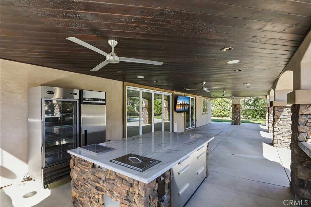 8075 Terraza Court Riverside, CA 92508 - Photo 34 of 75 a open kitchen with stainless steel appliances granite countertop a stove and a refrigerator