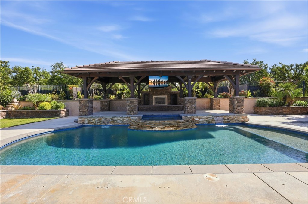 8075 Terraza Court Riverside, CA 92508 - Photo 36 of 75 a view of swimming pool with outdoor seating and yard in back