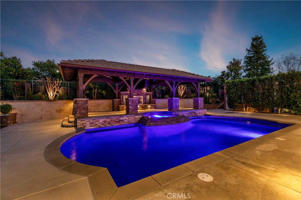 8075 Terraza Court Riverside, CA 92508 - Photo 41 of 75 a view of swimming pool with chairs in front of house