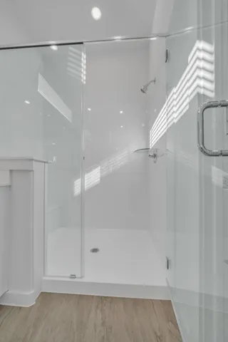 a bathroom with a shower and a shower