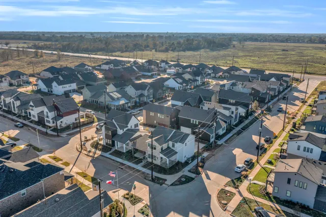 an aerial view of ocean and city