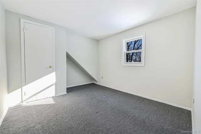 a view of a hallway with closet