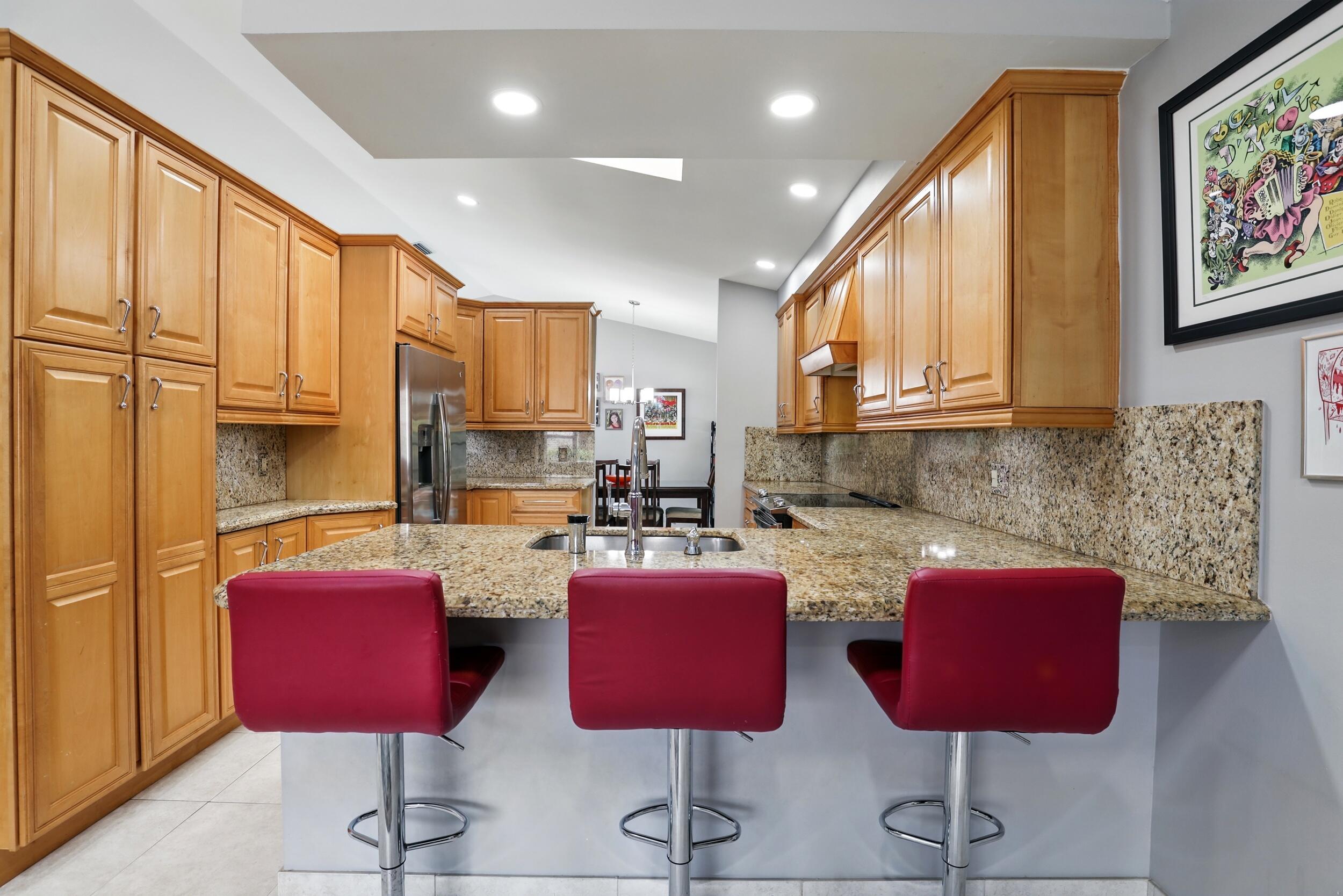 5183 Beechwood Road Delray Beach, FL 33484 - Photo 17 of 48 Kitchen W/ Breakfast Bar