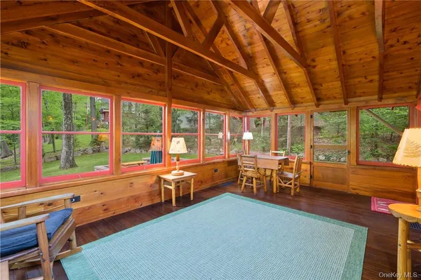 a room with chairs and window