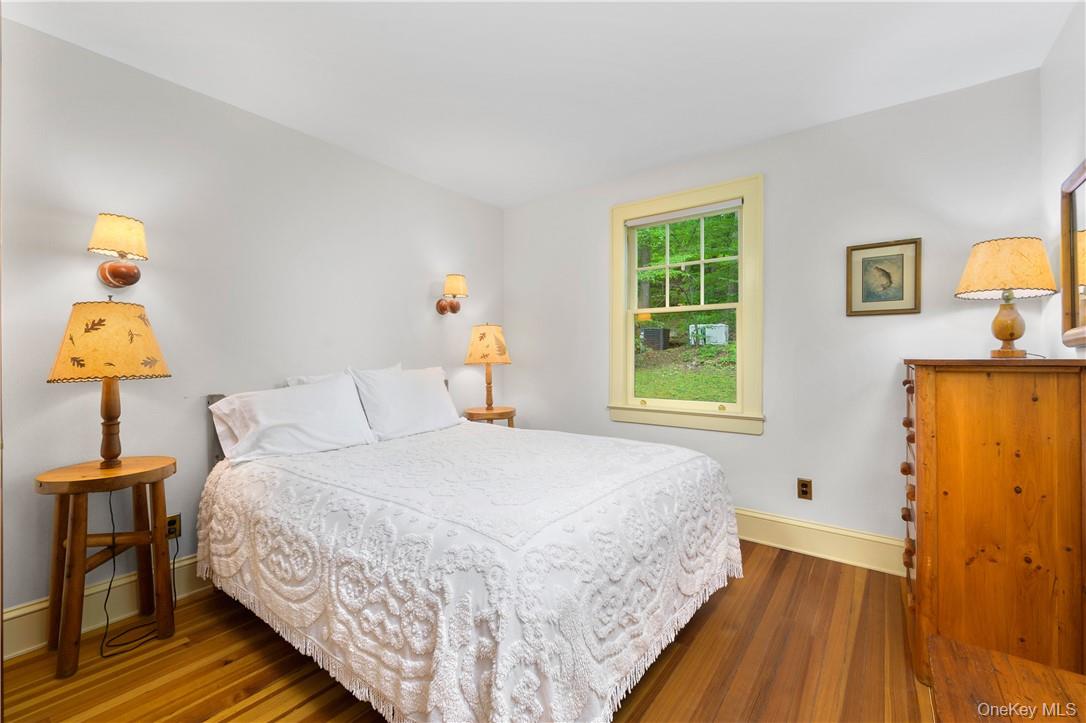 77 Lake Drive Cold Spring, NY 10516 - Photo 15 of 49 a bedroom with a bed and a window