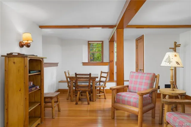 a dining room with furniture and window