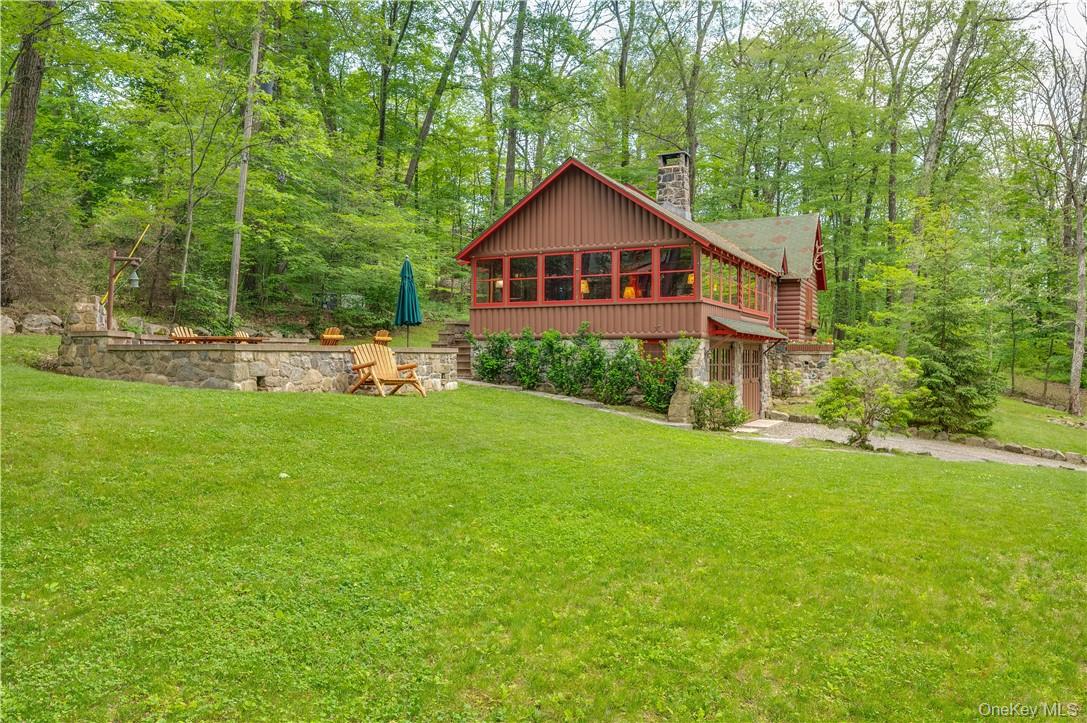 77 Lake Drive Cold Spring, NY 10516 - Photo 28 of 49 a front view of a house with garden