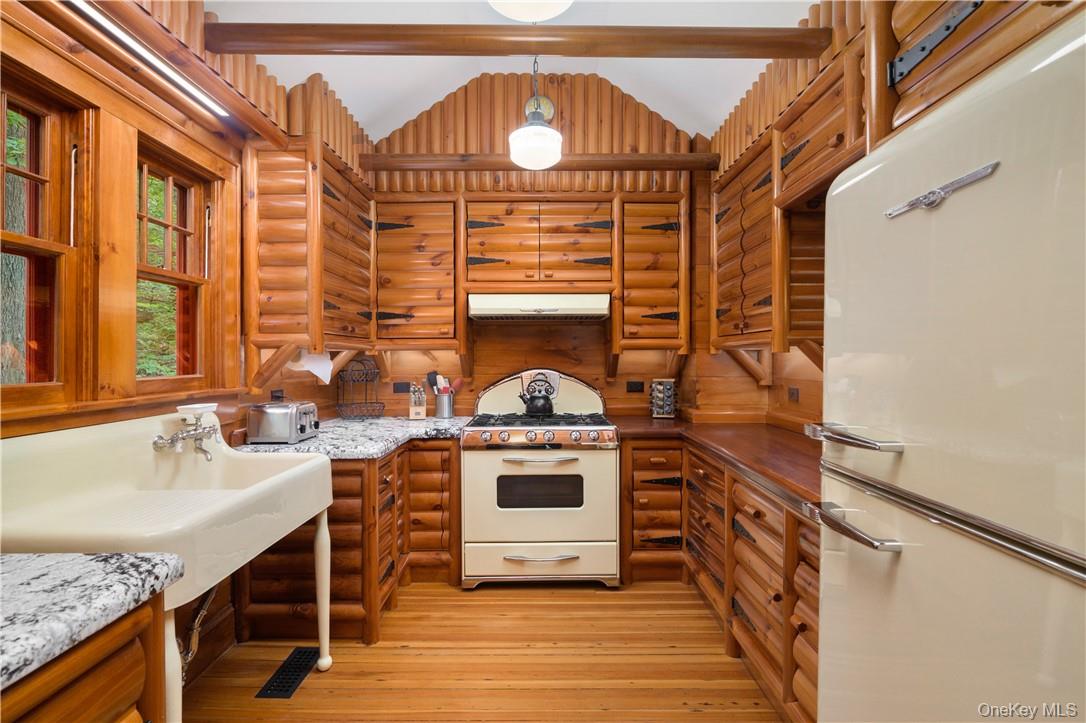 77 Lake Drive Cold Spring, NY 10516 - Photo 9 of 49 a kitchen with stainless steel appliances granite countertop a stove and a sink