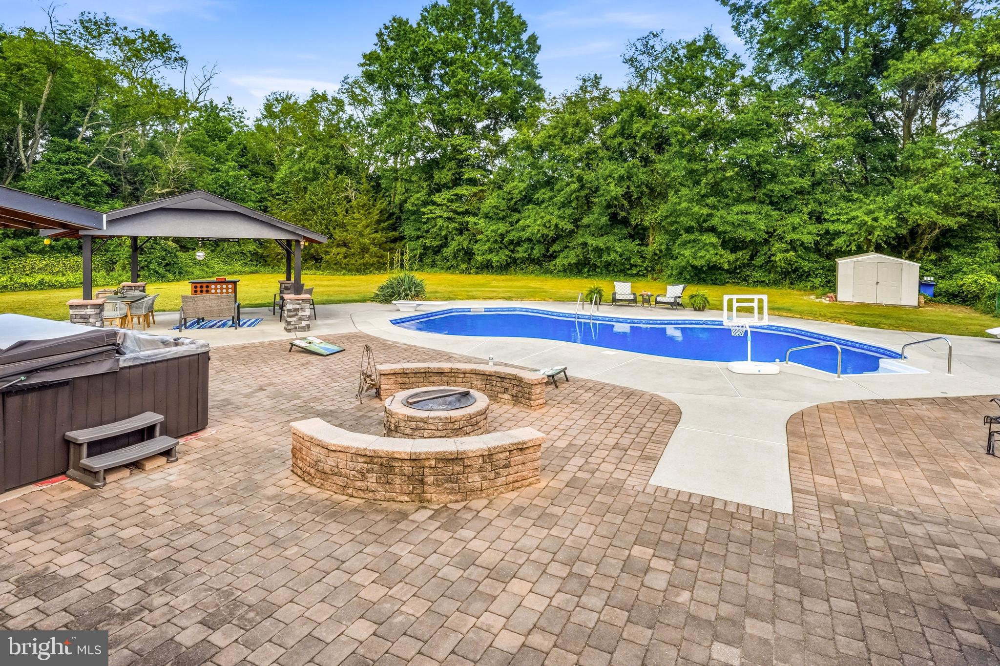 705 Garden Road Pittsgrove, NJ 08318 - Photo 62 of 72 a view of a swimming pool with lounge chairs