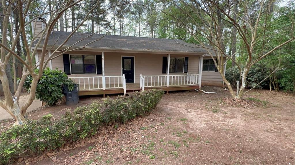 99 Fox Ridge Court Dallas, GA 30157 - Photo 1 of 1 a view of a house with a small yard and large tree