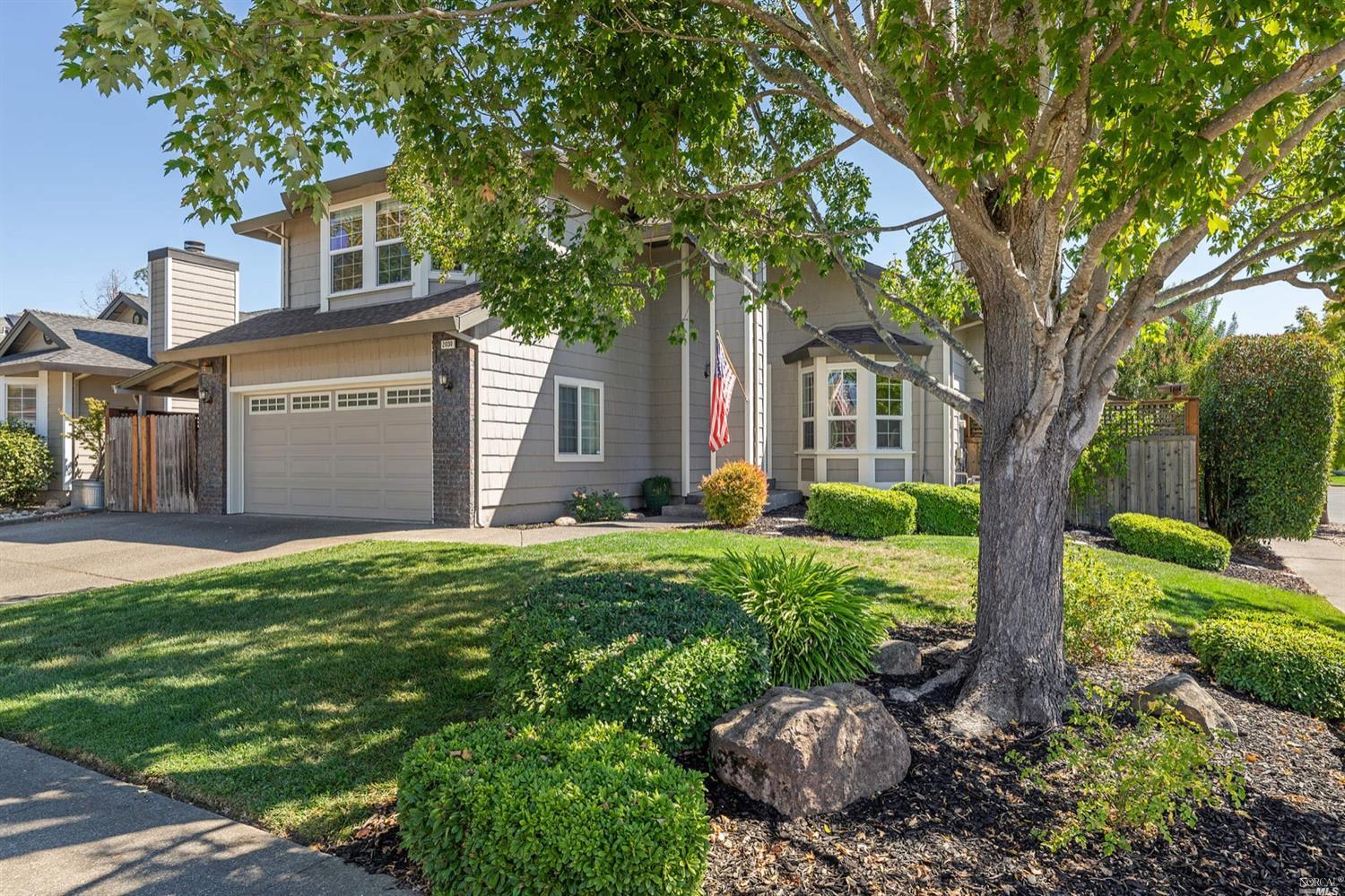 2030 Seville Street Santa Rosa, CA 95403 - Photo 1 of 1 a front view of a house with a garden