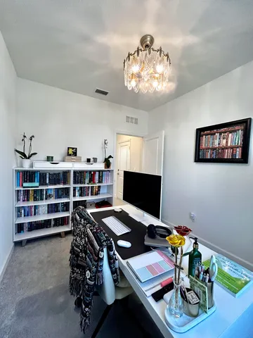 a workspace with furniture and wooden floor