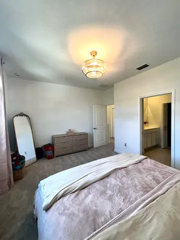 a view of walk in closet and window