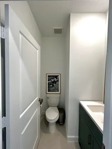 a bathroom with a toilet a sink and a bathtub