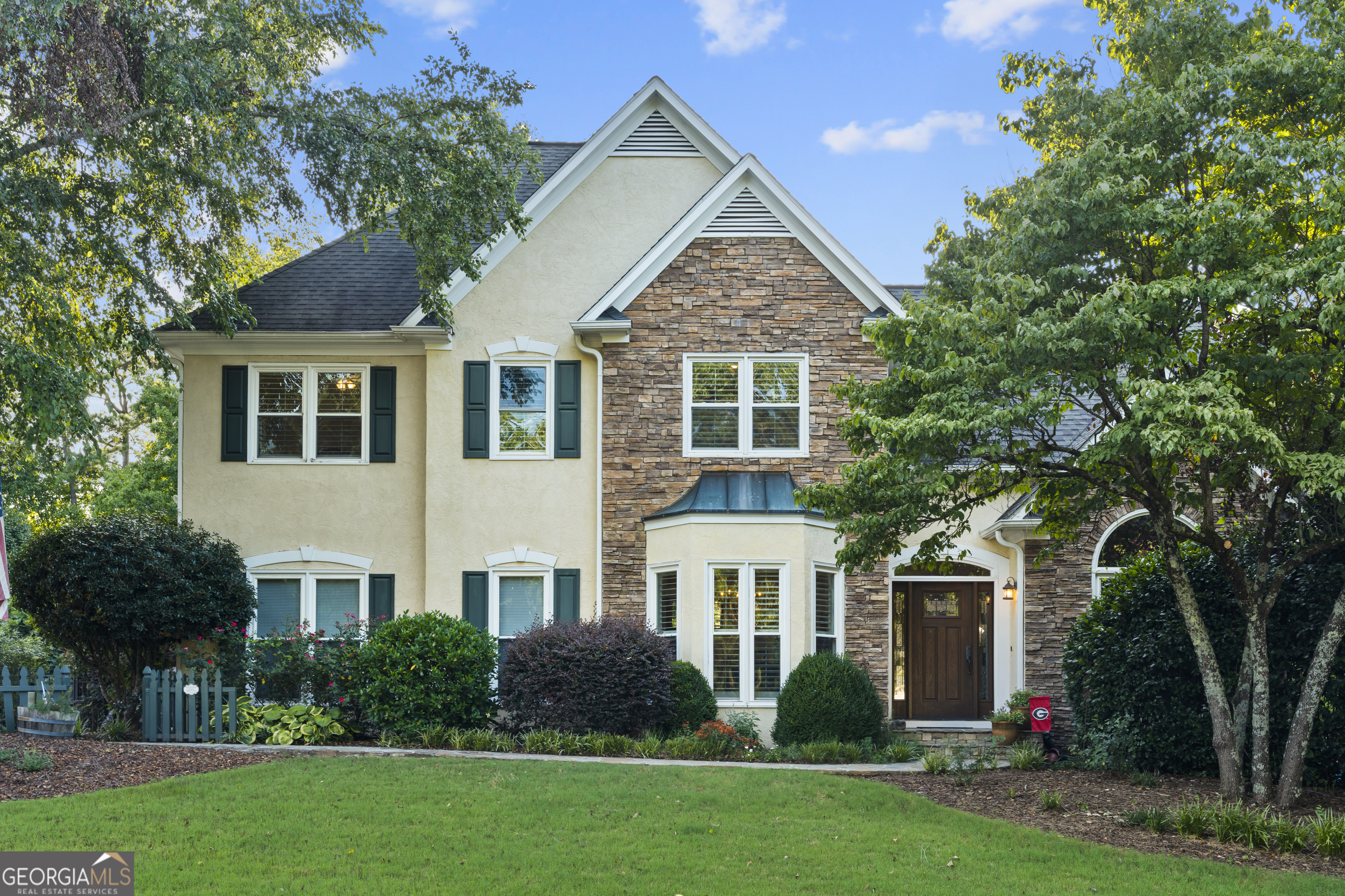 109 Fielding Ridge Peachtree City, GA 30269 - Photo 1 of 1 a front view of a house with a yard and trees