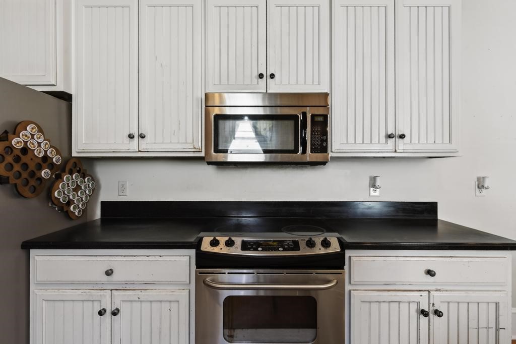 45107 Booth Street Callahan, FL 32011 - Photo 20 of 68 a stove top oven sitting inside of a kitchen