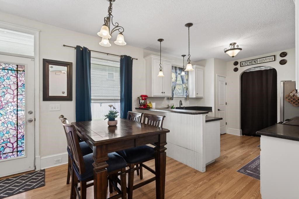45107 Booth Street Callahan, FL 32011 - Photo 22 of 68 a kitchen with a dining table and chairs