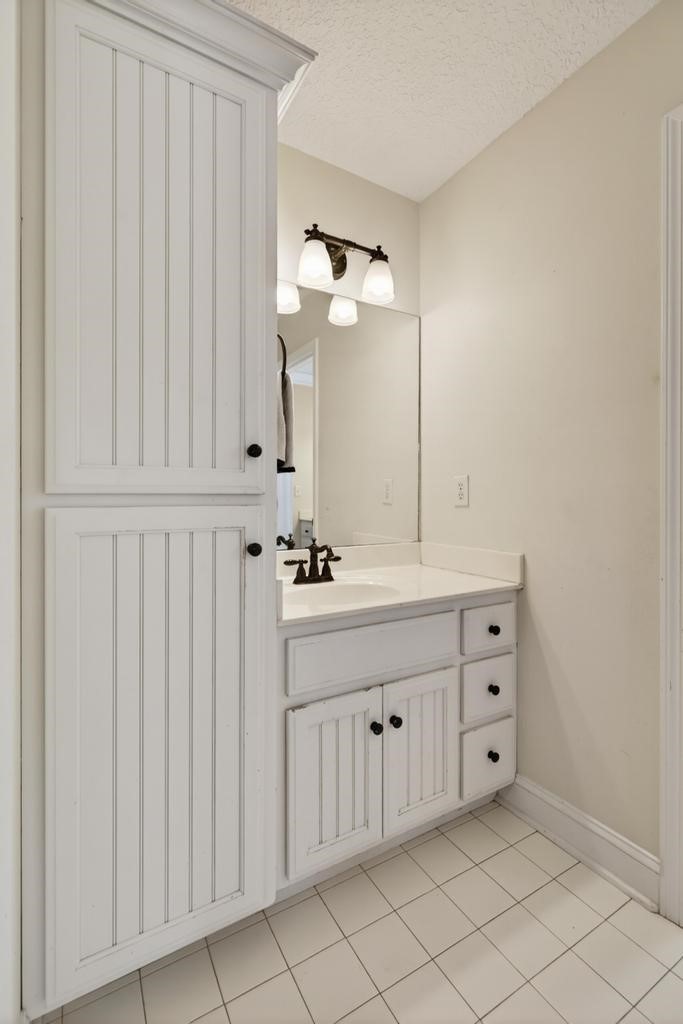 45107 Booth Street Callahan, FL 32011 - Photo 41 of 68 a bathroom with a double vanity sink a mirror and a