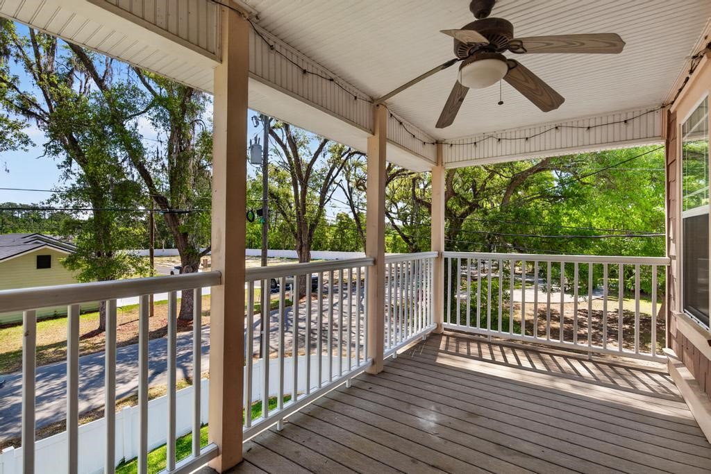 45107 Booth Street Callahan, FL 32011 - Photo 48 of 68 a view of a balcony with furniture and wooden floor