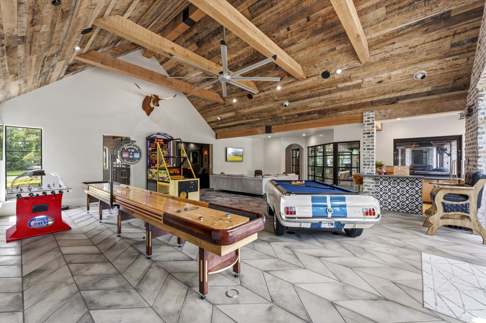 27006 Star Gazer Way Spring, TX 77386 - Photo 8 of 50 Perfect for hosting family and guests, this game room includes a private bunk room designed to accommodate six with thoughtful details for comfortable stays.