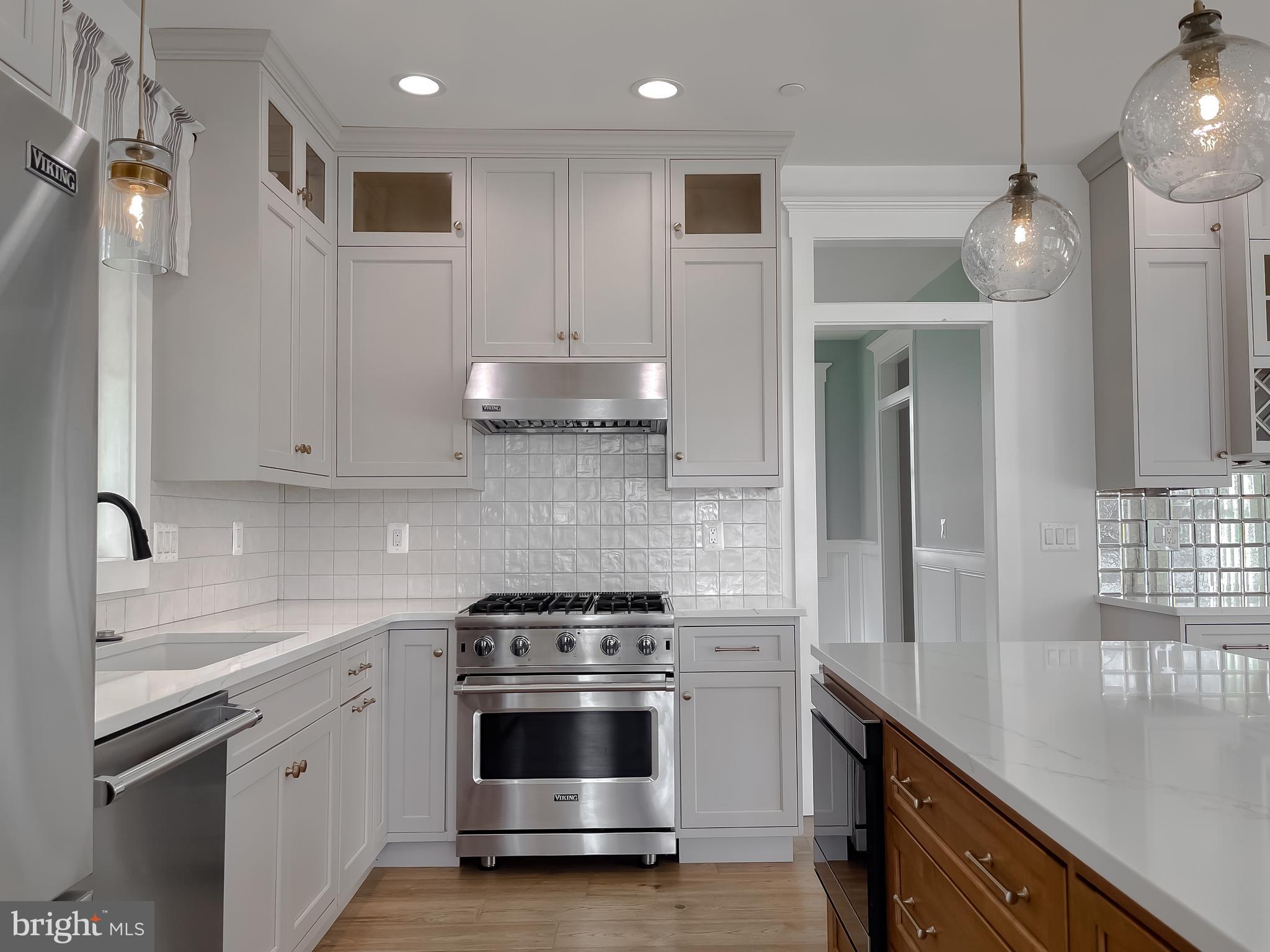 45093 Smiths Nursery Road Hollywood, MD 20636 - Photo 18 of 79 a kitchen with stainless steel appliances granite countertop a sink a stove and a refrigerator