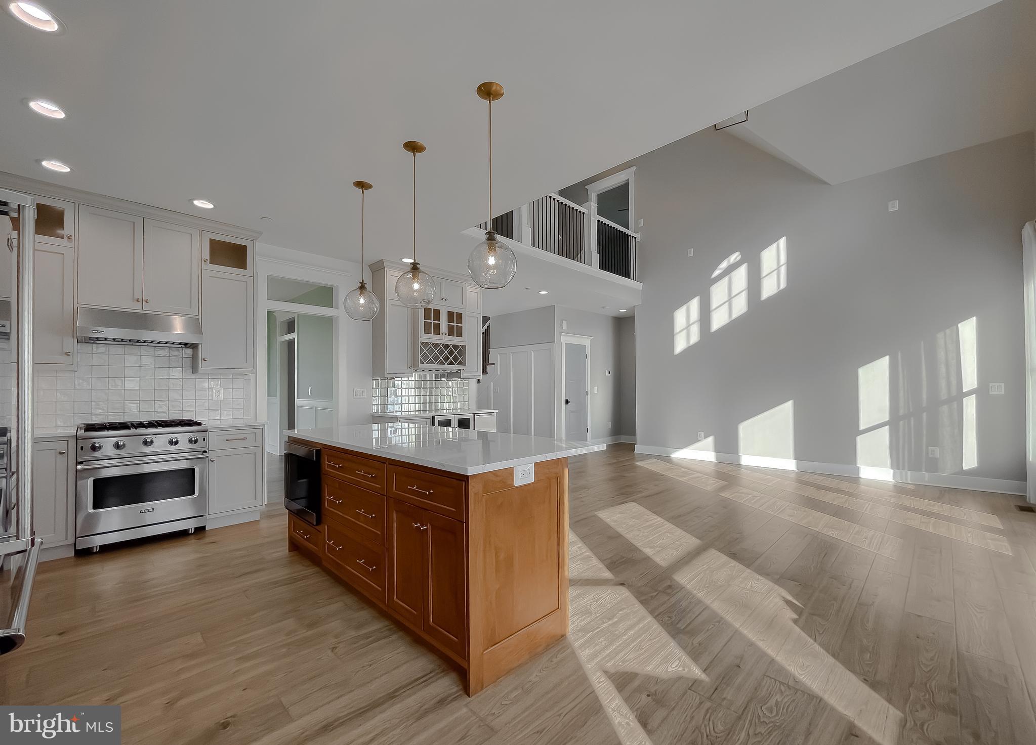 45093 Smiths Nursery Road Hollywood, MD 20636 - Photo 19 of 79 a large kitchen with stainless steel appliances granite countertop a stove and a refrigerator