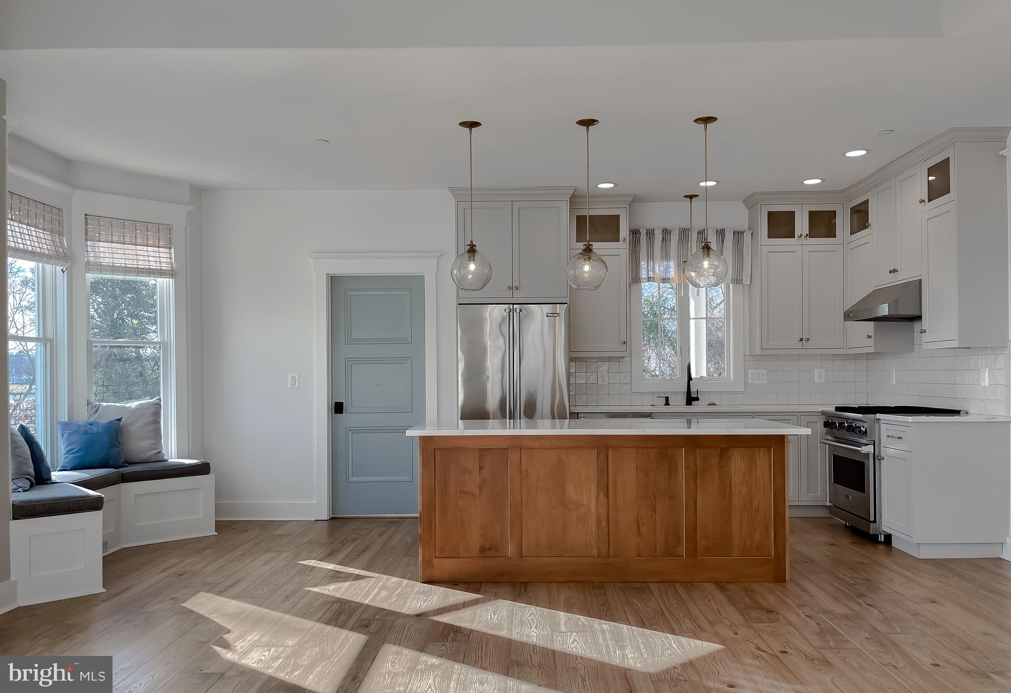 45093 Smiths Nursery Road Hollywood, MD 20636 - Photo 23 of 79 a large kitchen with stainless steel appliances kitchen island granite countertop a sink and cabinets
