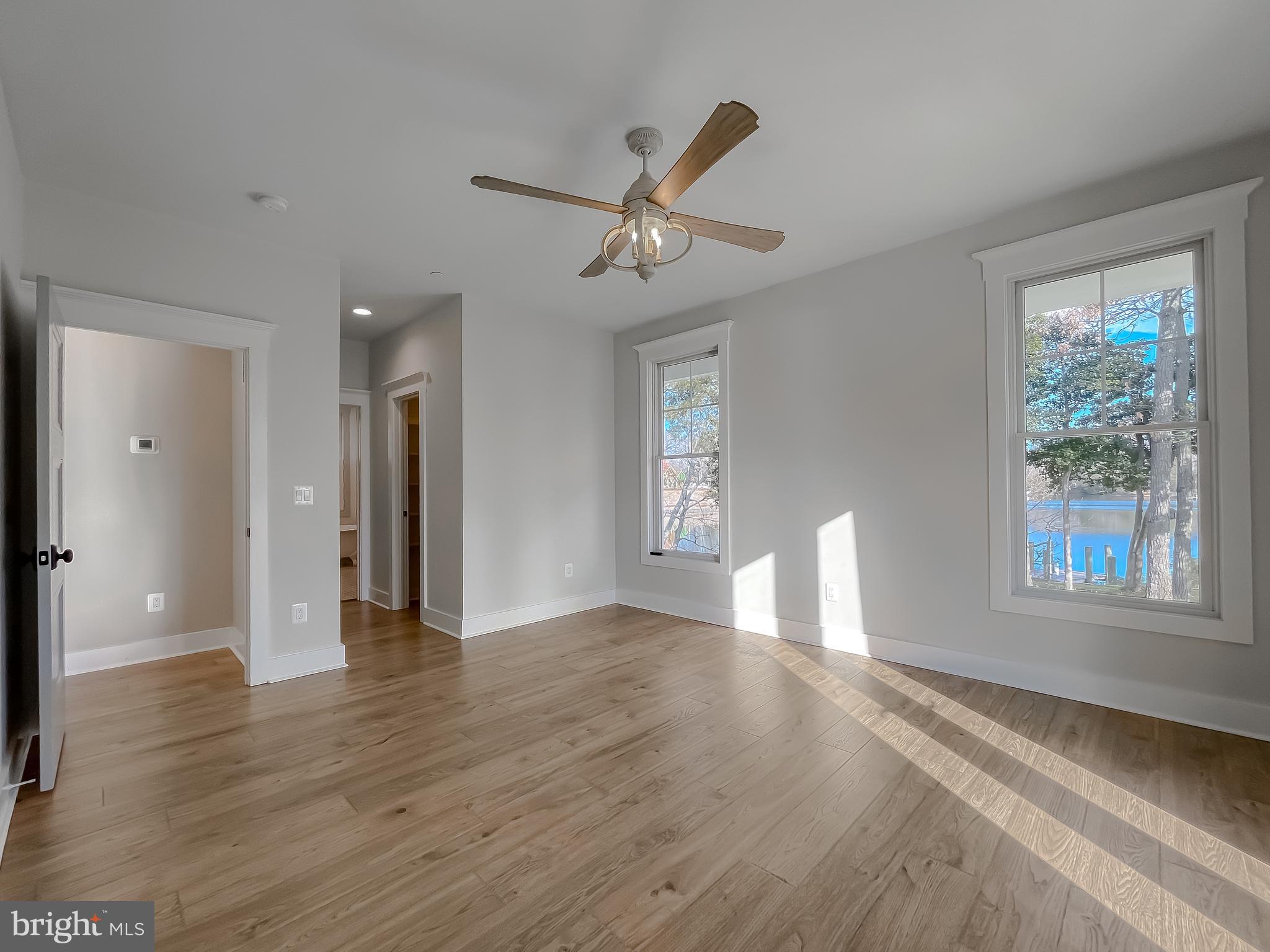 45093 Smiths Nursery Road Hollywood, MD 20636 - Photo 27 of 79 a view of an empty room with wooden floor and a window