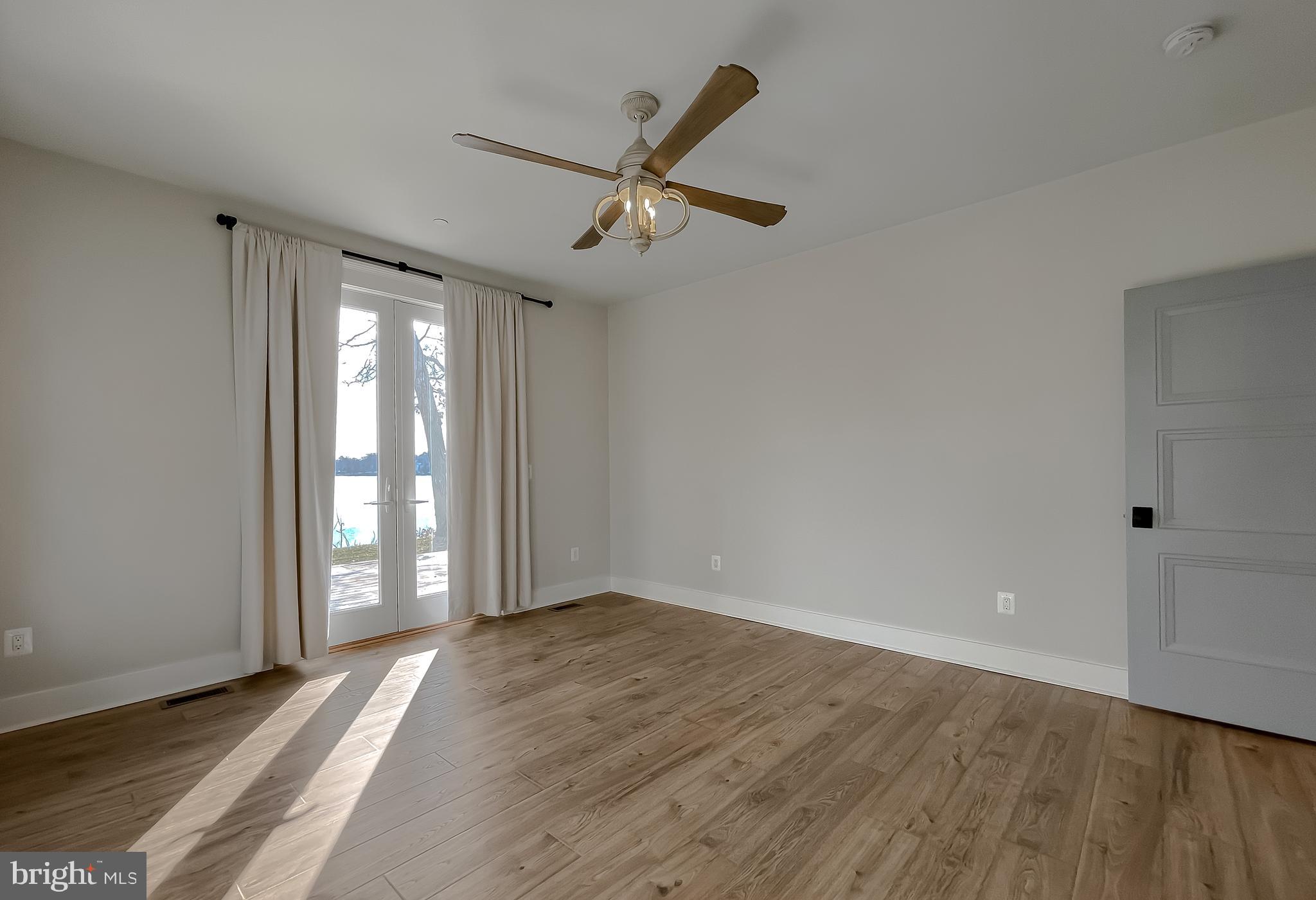 45093 Smiths Nursery Road Hollywood, MD 20636 - Photo 29 of 79 wooden floor in an empty room with a window