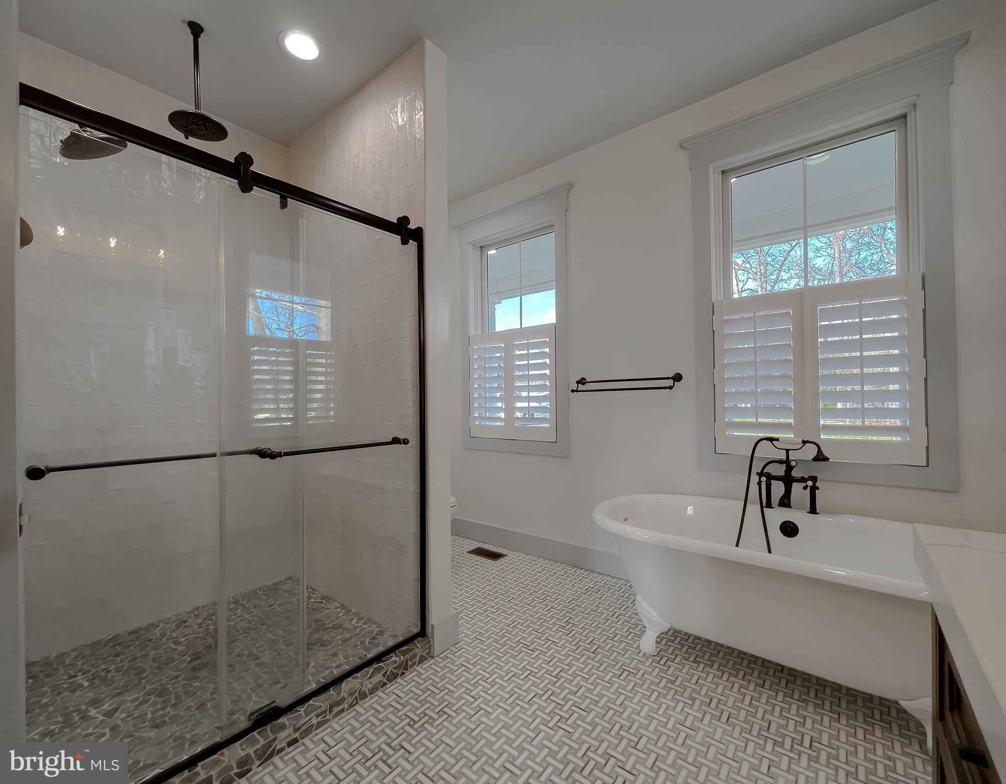 45093 Smiths Nursery Road Hollywood, MD 20636 - Photo 34 of 79 a bathroom with a sink a mirror and shower