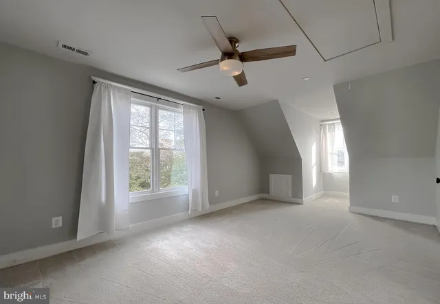 a view of swimming pool and brick wall