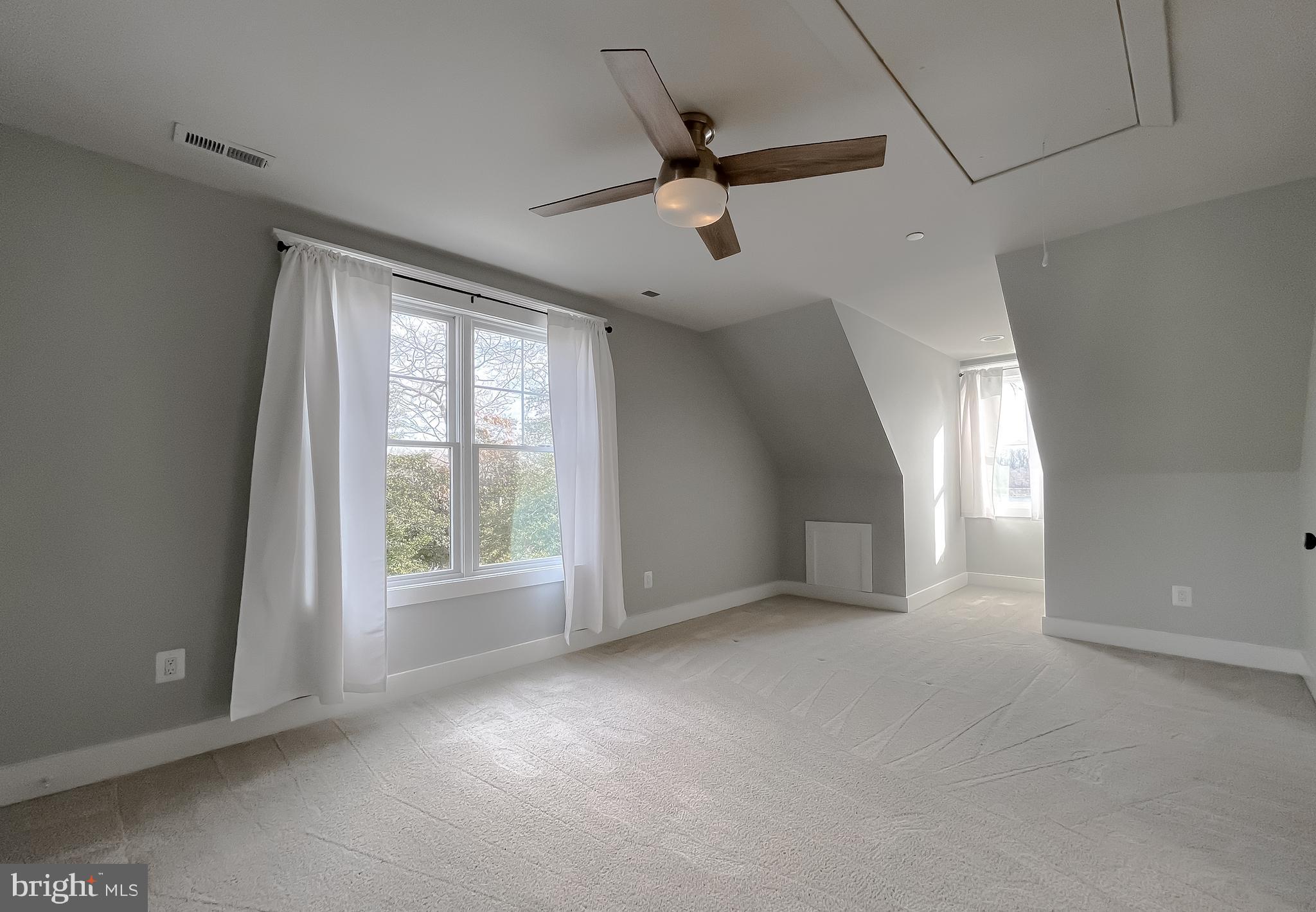 45093 Smiths Nursery Road Hollywood, MD 20636 - Photo 44 of 79 a view of a livingroom with a ceiling fan and window