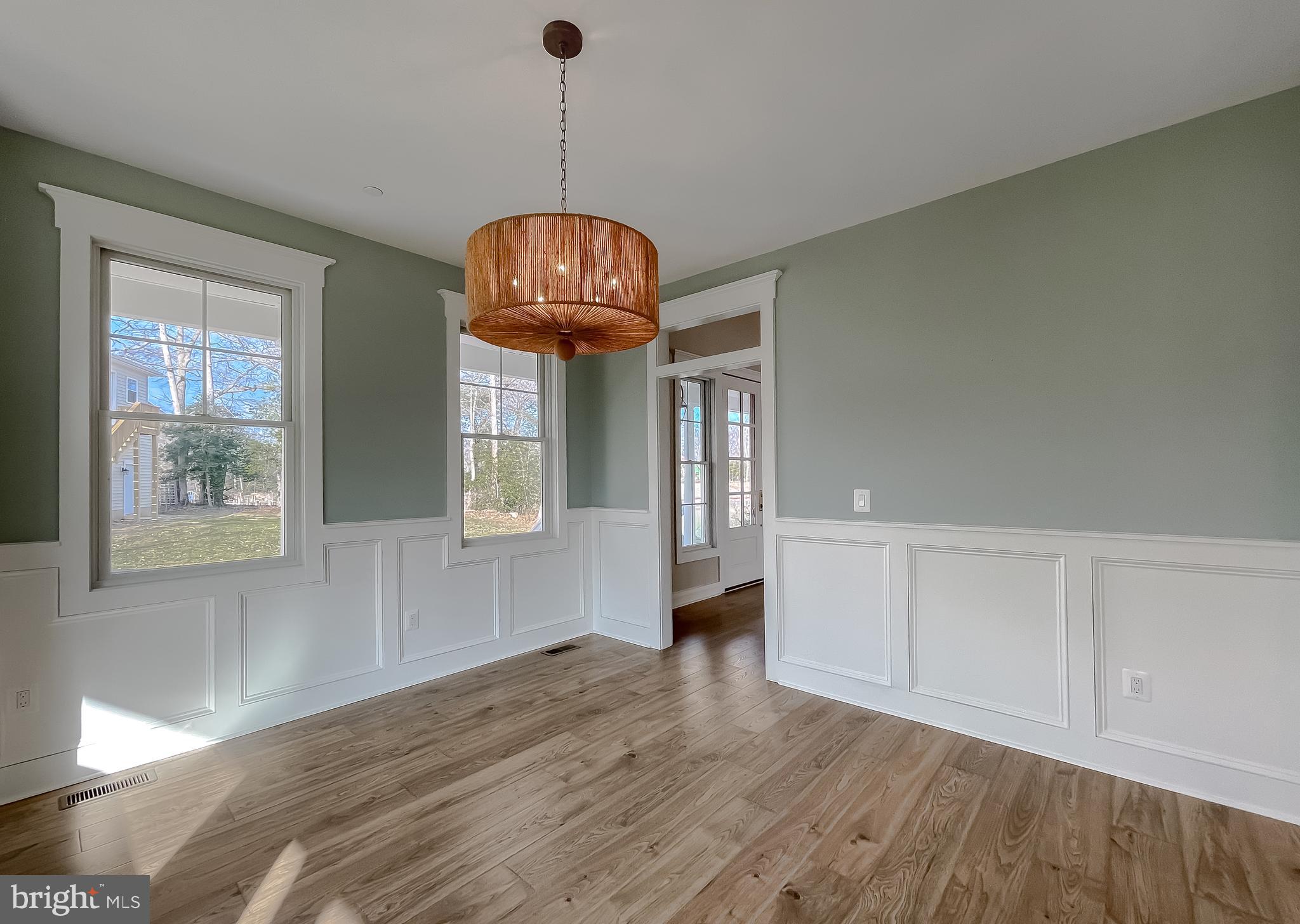 45093 Smiths Nursery Road Hollywood, MD 20636 - Photo 9 of 79 a view of empty room with wooden floor and fan