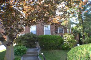 84 Devoe Avenue Yonkers, NY 10705 - Photo 1 of 1 a couple of potted plants in front of a house