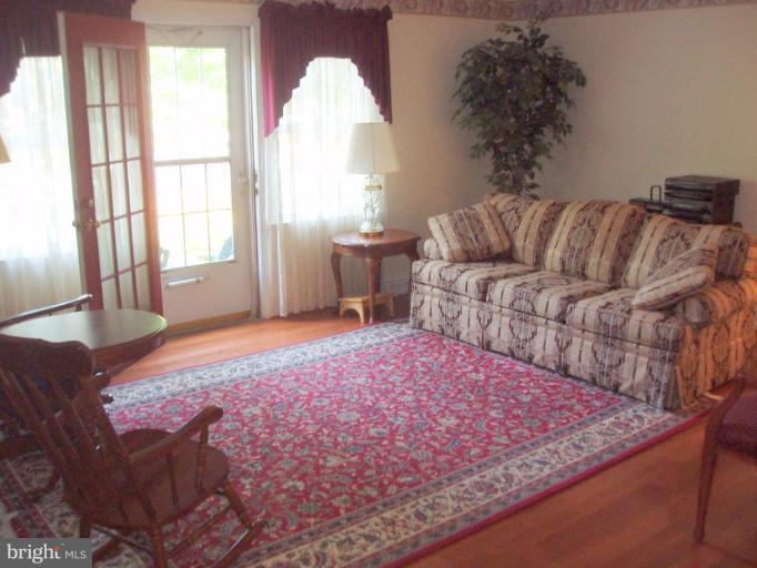 482 Colonial Ridge Lane, Unit 99 Arnold, MD 21012 - Photo 14 of 28 LR has wood flooring & french door to back garden!