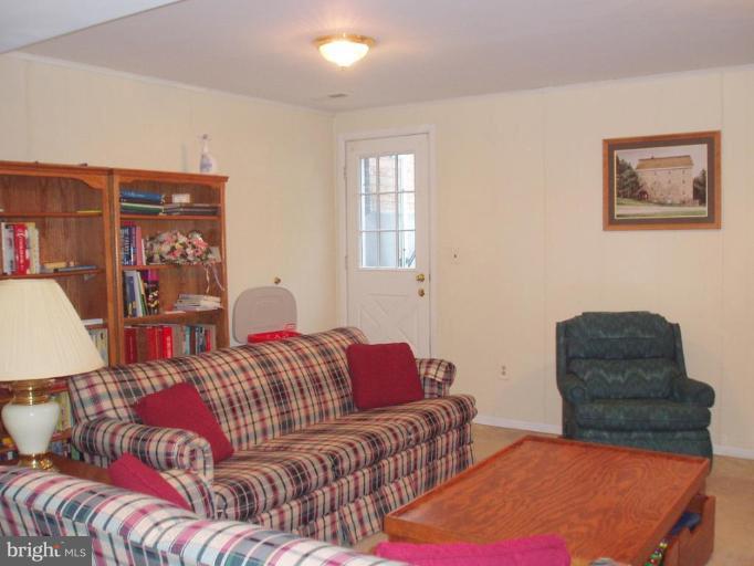 482 Colonial Ridge Lane, Unit 99 Arnold, MD 21012 - Photo 22 of 28 Large Family Room with door to steps to back yard!