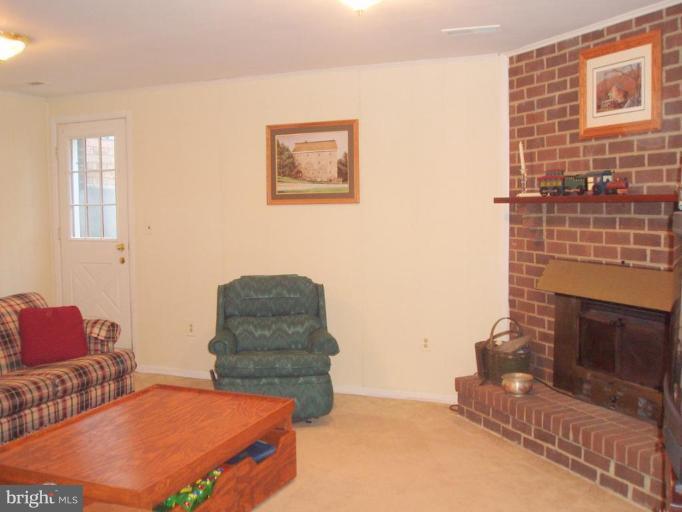 482 Colonial Ridge Lane, Unit 99 Arnold, MD 21012 - Photo 8 of 28 Family Rm has Fireplace & door to outside!