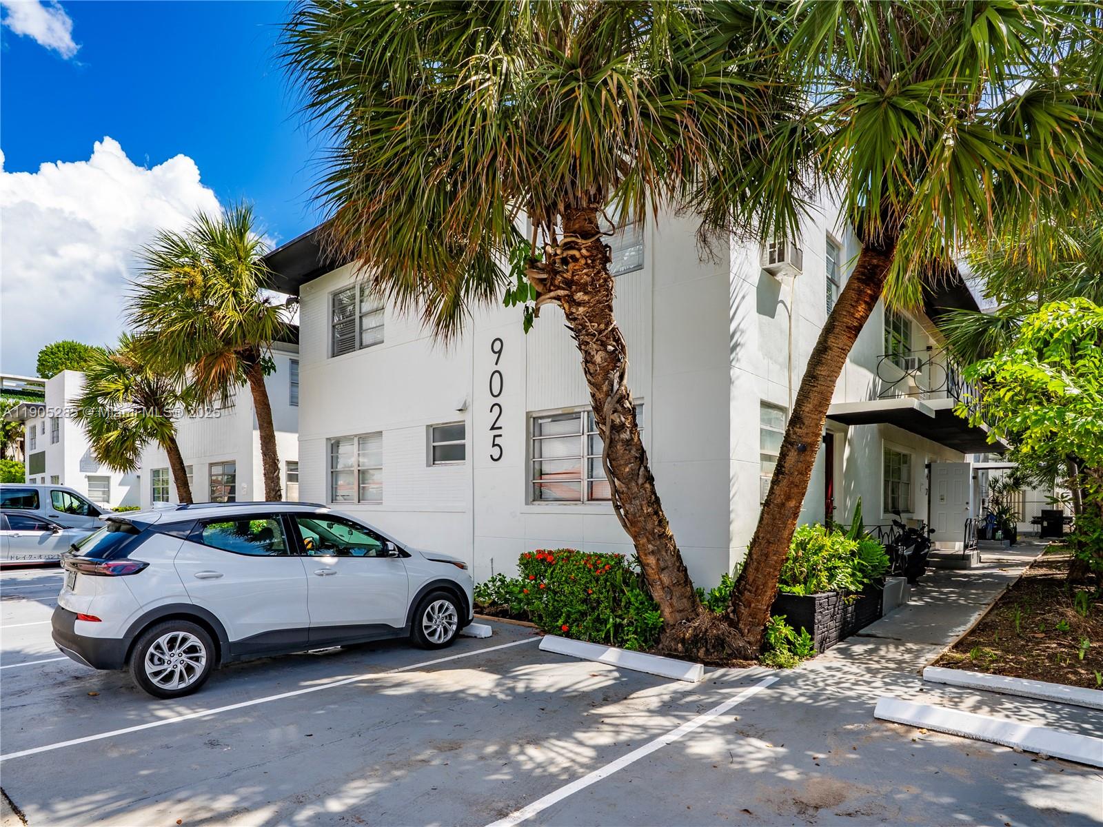 9025 Harding Avenue, Unit 1 Surfside, FL 33154 - Photo 1 of 25 a view of yard with car parked